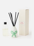 Oliver Bonas cream green striped ceramic reed diffuser, imported from the UK