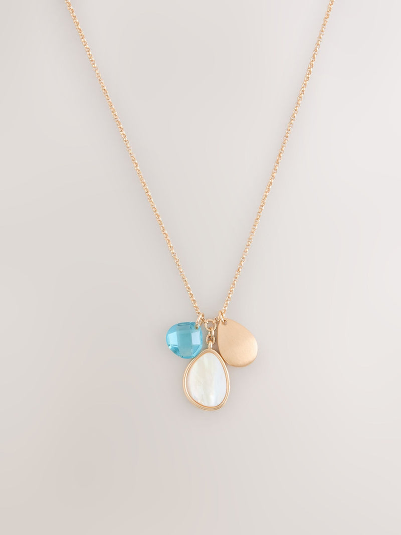 Gold tone cluster disc necklace with turquoise gemstone (British brand)