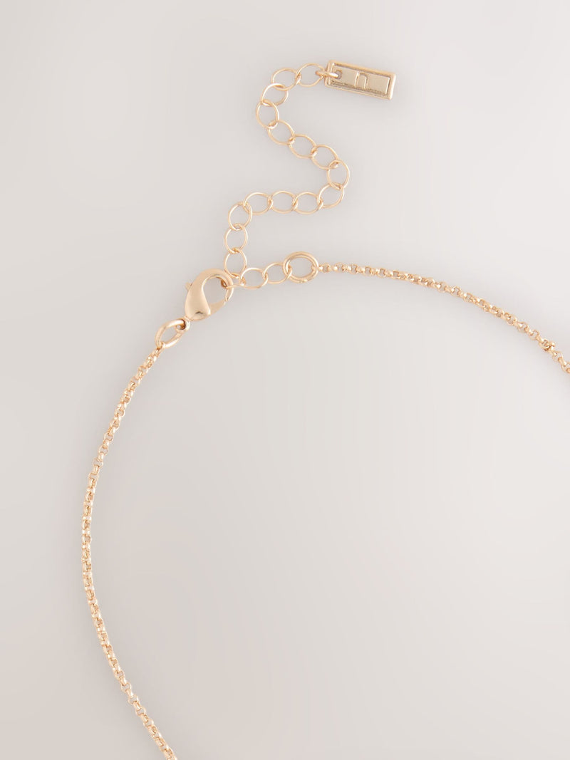 Gold tone cluster disc necklace with turquoise gemstone (British brand)