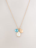 Gold tone cluster disc necklace with turquoise gemstone (British brand)
