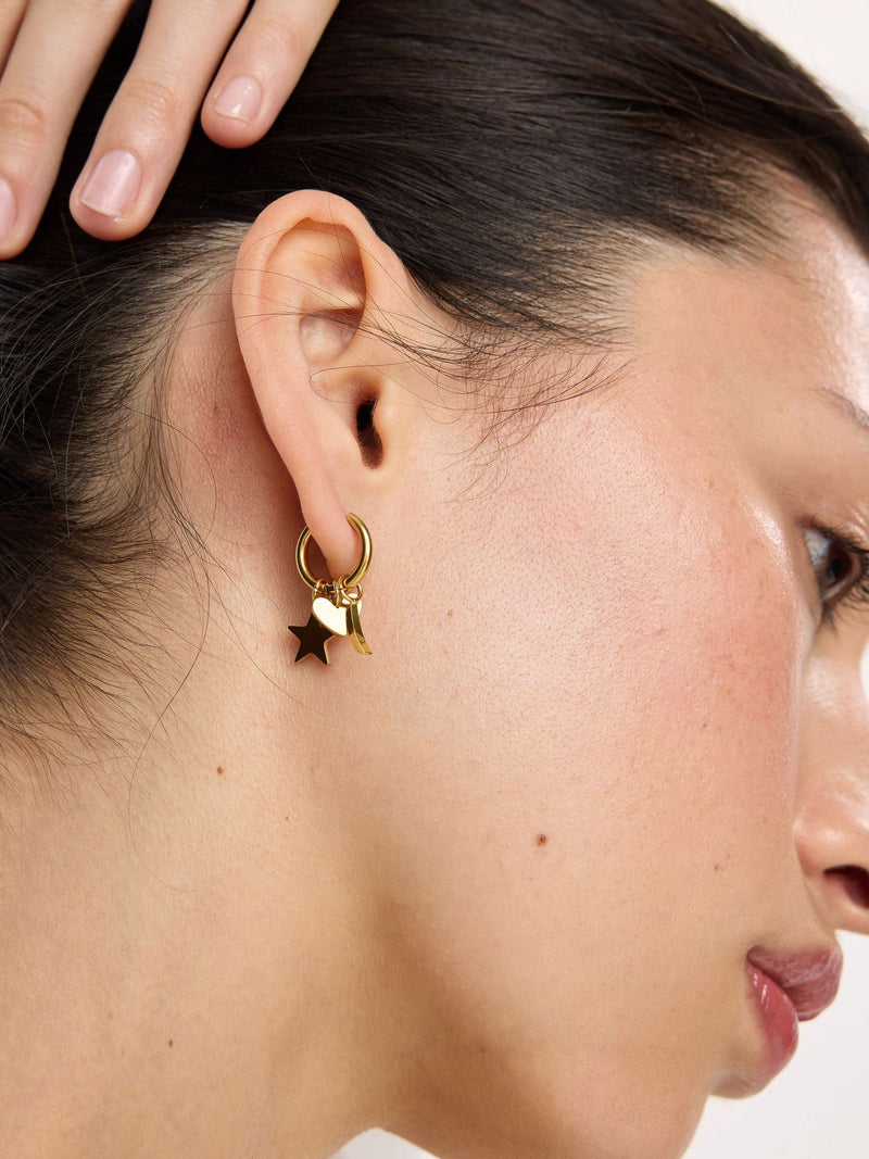 Oliver Bonas gold tone hoop earrings with star moon heart charms (British brand)