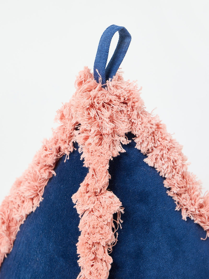 Oliver Bonas blue velvet door stop with pink trim, imported from the UK
