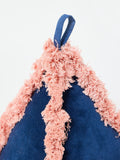 Oliver Bonas blue velvet door stop with pink trim, imported from the UK