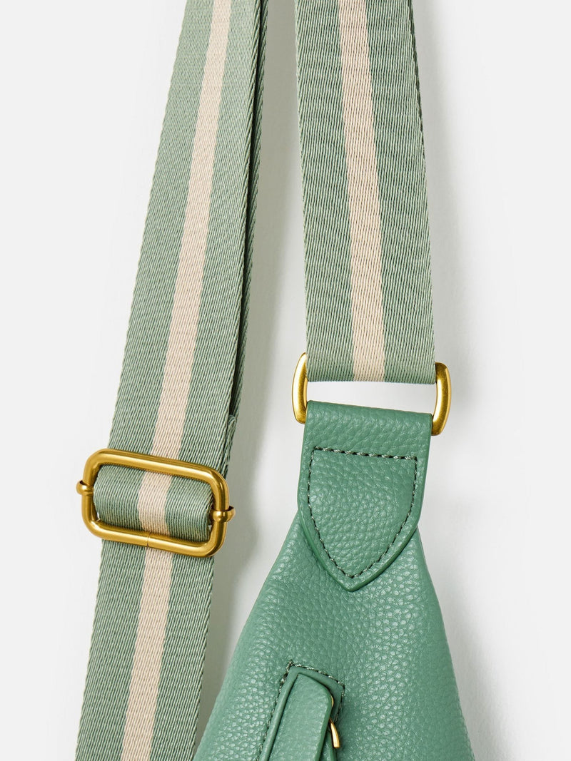 Oliver Bonas sage green belt bag, imported from the UK
