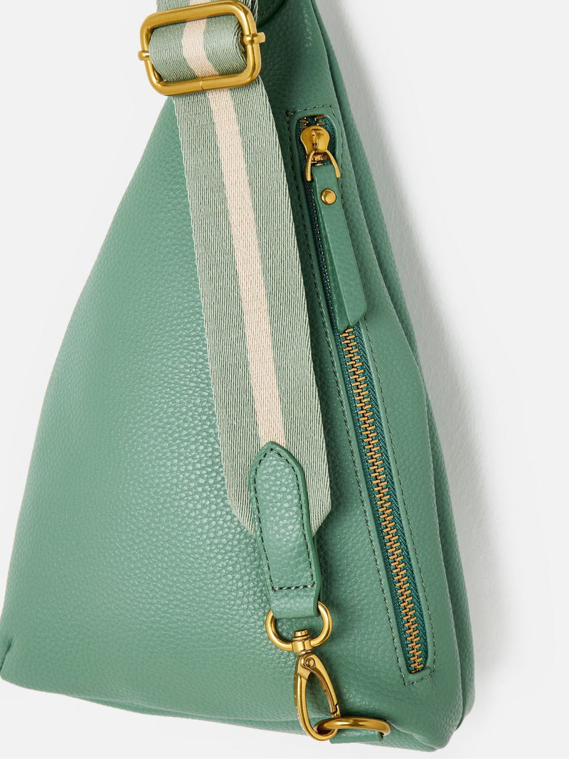 Oliver Bonas sage green belt bag, imported from the UK