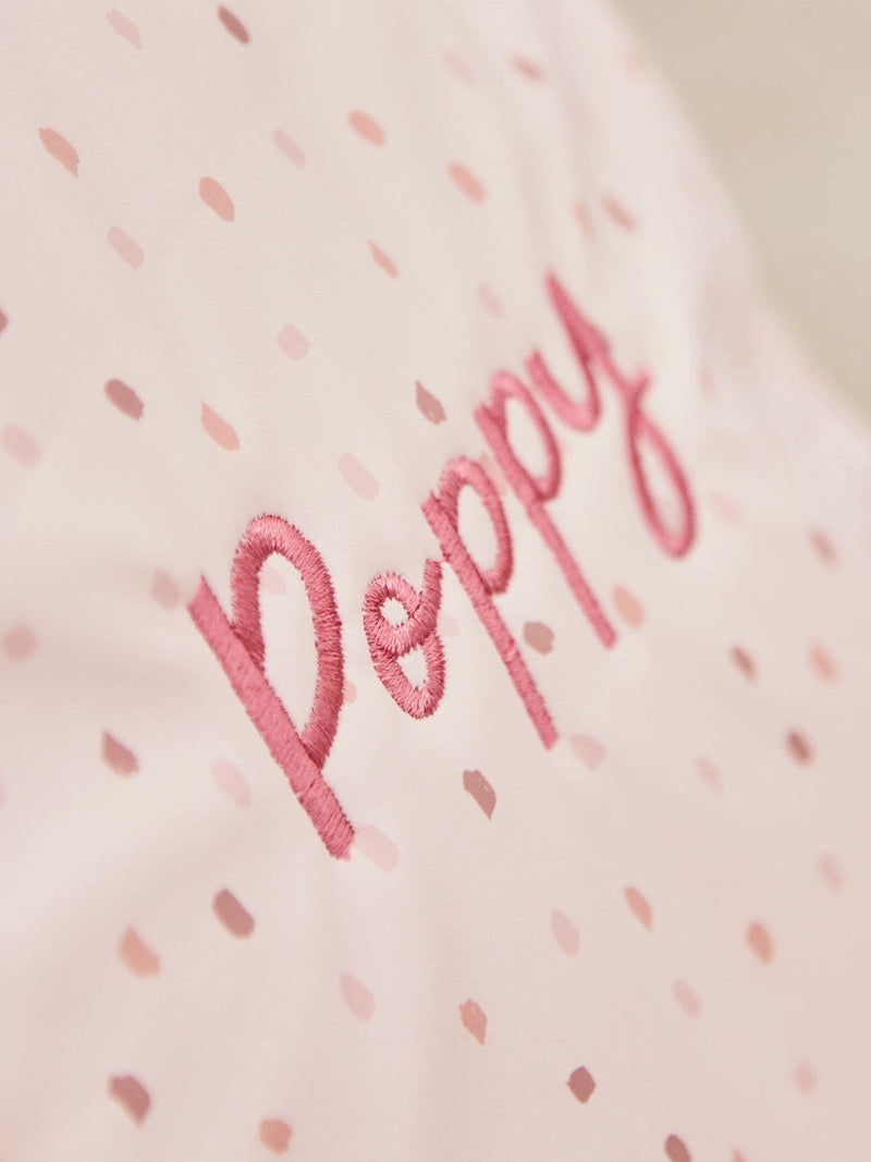 Pink polka dot tiny personalised backpack (British brand)