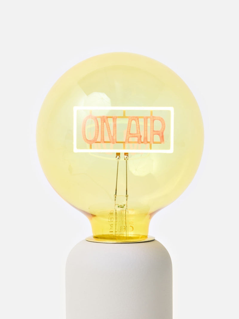 Oliver Bonas yellow On Air glass light bulb (British brand)