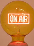 Oliver Bonas yellow On Air glass light bulb (British brand)