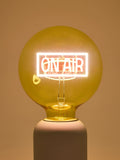 Oliver Bonas yellow On Air glass light bulb (British brand)