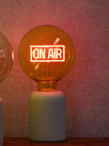 Oliver Bonas yellow On Air glass light bulb (British brand)