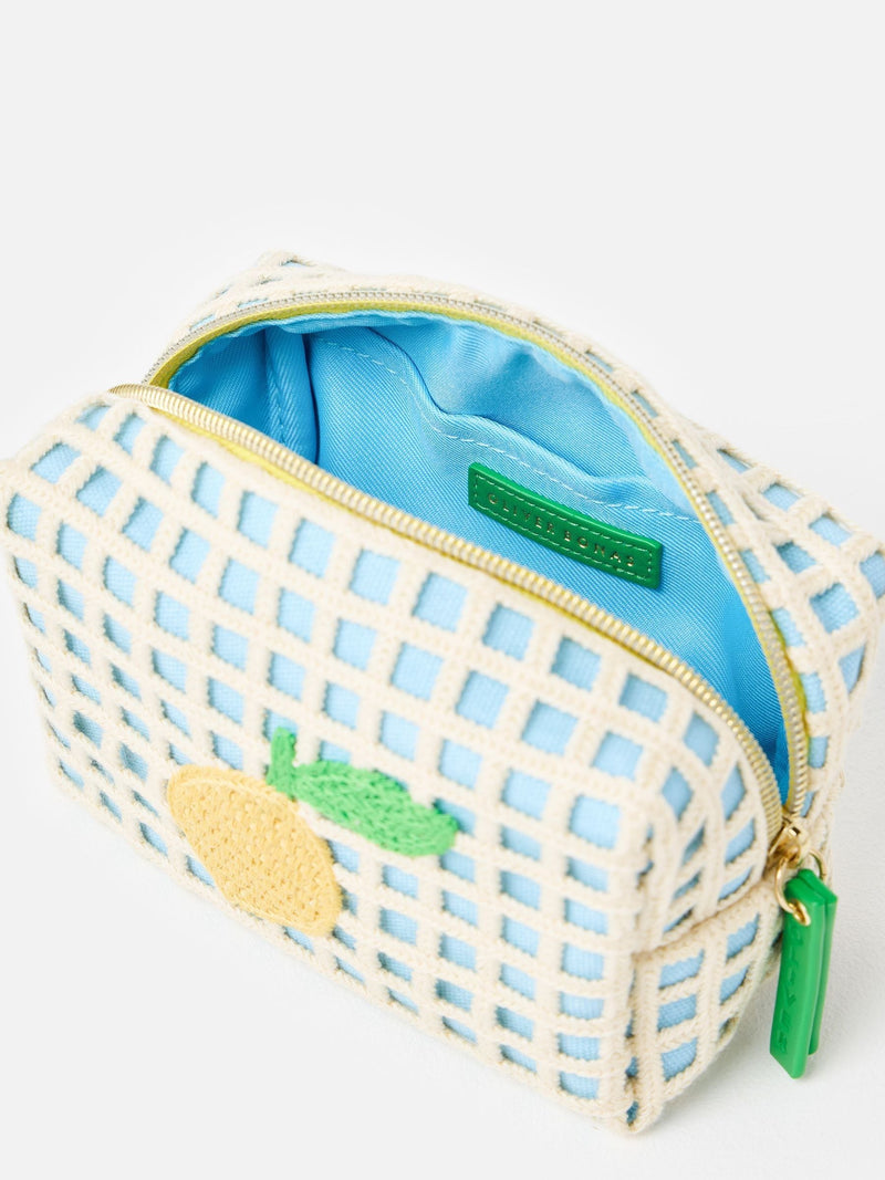 Oliver Bonas blue crochet makeup bag with lemon motif (British brand)