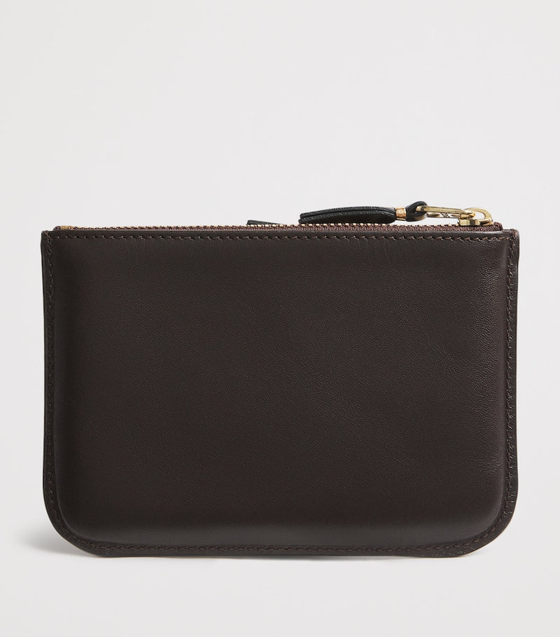 Comme des Garçons medium leather outside pocket wallet, imported from the UK