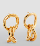 Isabel Marant multi-hoop earrings in polished brass, imported from the UK