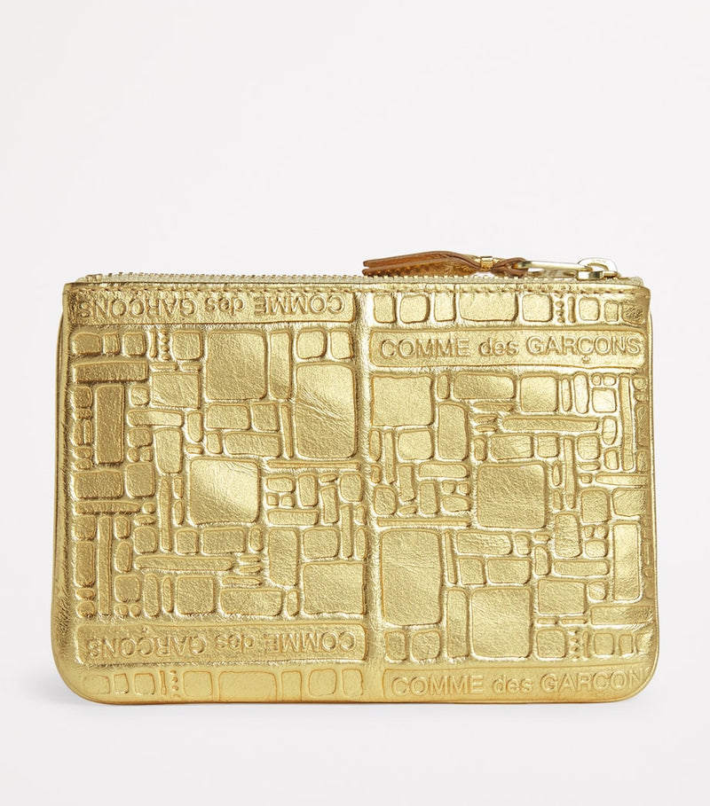 Comme des Garçons gold leather embossed zipped pouch, imported from the UK