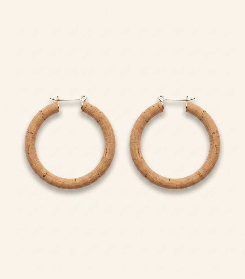 Balenciaga polished copper hoop earrings, imported from the UK
