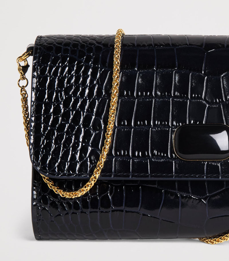 Jeffrey Levinson croc-embossed leather clutch bag, UK version