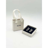 SVNX ribbed oval hoop earrings in silver, imported from the UK