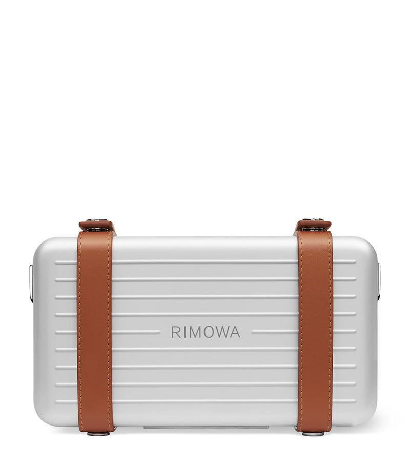 RIMOWA aluminium cross-body bag with leather strap (British brand)