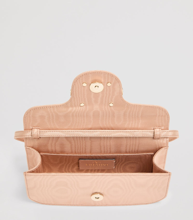 Valentino Garavani Moiré Locò clutch bag (British brand)