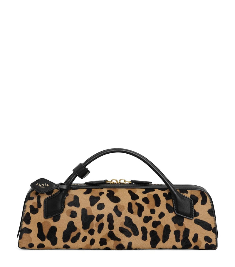 Alaïa Le Teckel leopard print clutch bag, imported from the UK