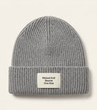 Prada wool-blend beanie with triangle plaque, imported from the UK