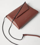 Brunello Cucinelli leather BC Pochette clutch bag, imported from the UK