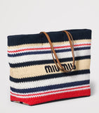 Miu Miu woven raffia-effect tote bag with logo (British brand)