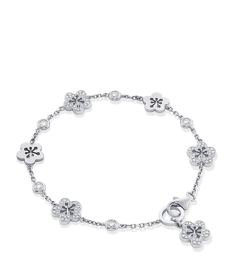 Boodles 18kt white gold diamond blossom charm bracelet, imported from the UK