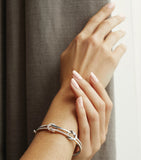 Boodles mixed gold diamond knot bangle (British brand)