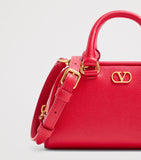 Valentino Garavani VLogo mini leather top-handle bag (British brand)