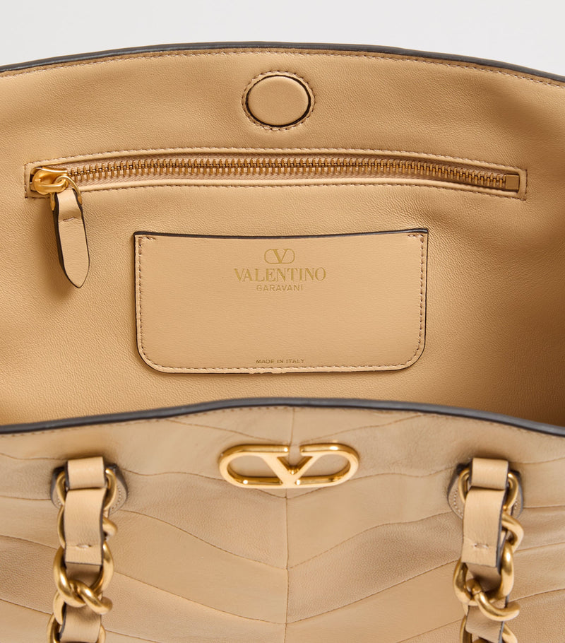 Valentino Garavani small lambskin Laseine tote bag, imported from the UK