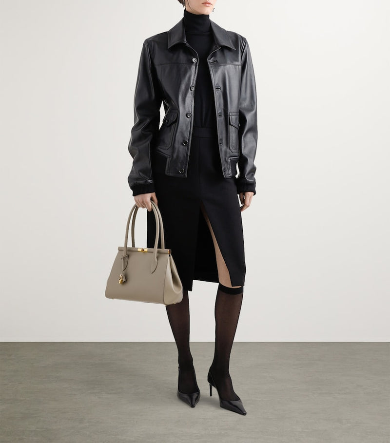 Dolce&Gabbana leather top-handle bag with gold-tone hardware, imported from the UK