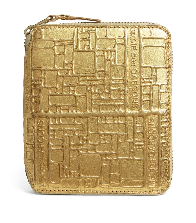 Comme Des Garçons gold embossed leather wallet, imported from the UK