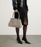 Dolce&Gabbana leather top-handle bag with gold-tone hardware, imported from the UK