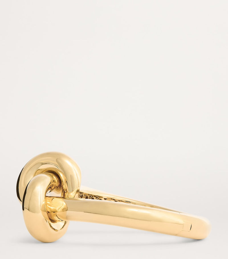 Engelbert yellow gold knot bangle with circular detailing - British product