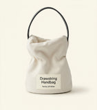 Prada Mini Re-Nylon bucket bag in recycled nylon (British brand)