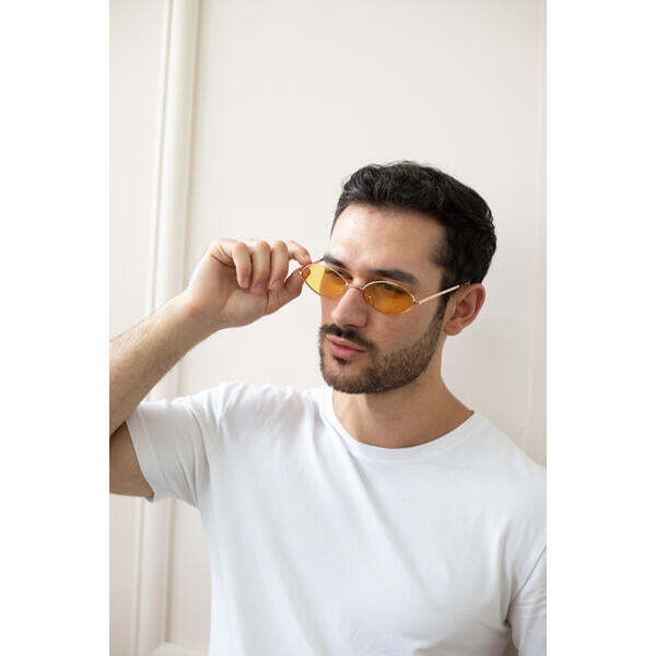 SVNX oval sunglasses with orange lenses and gold frame, imported from the UK