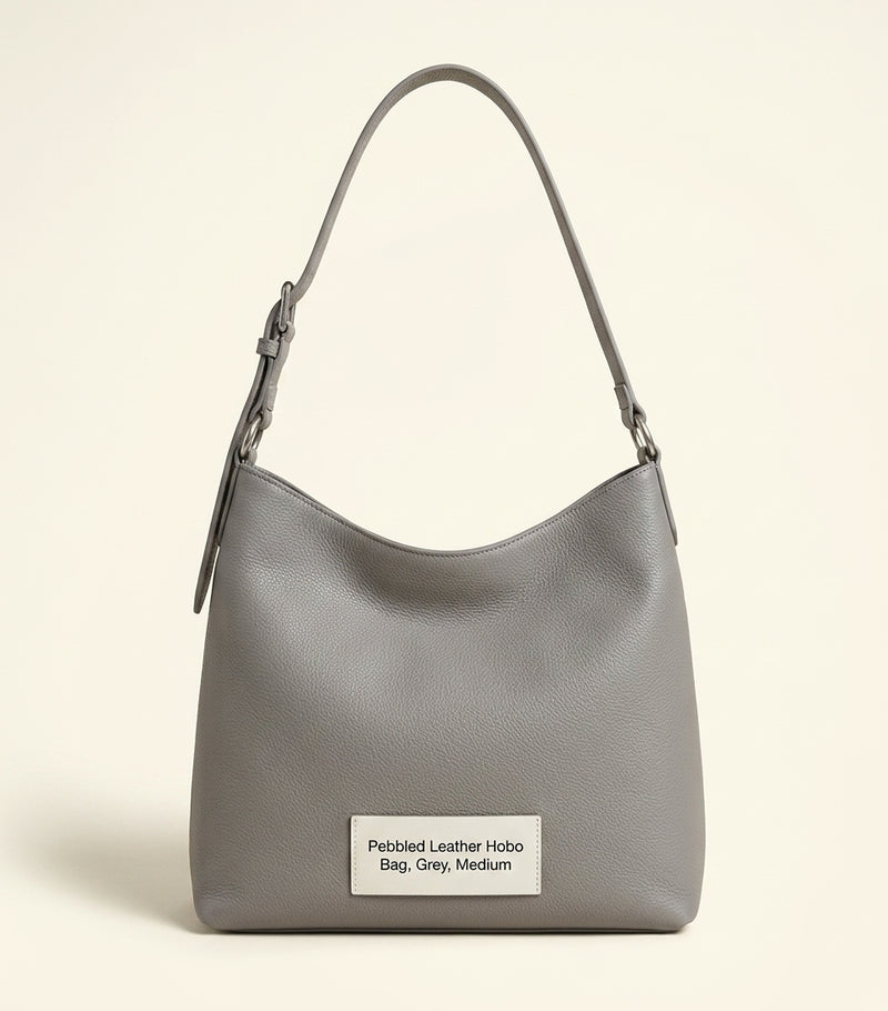 Balenciaga XS Le Cagole shoulder bag in studded lambskin, imported from the UK