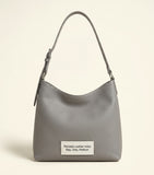Balenciaga XS Le Cagole shoulder bag in studded lambskin, imported from the UK