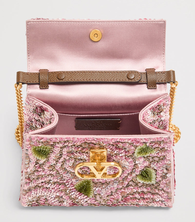 Valentino Garavani mini sequinned VSLING top-handle bag (British brand)