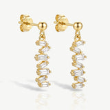 Superdrug MUCHV Long Drop Earrings with Baguette Stones in Gold 3cm- Buy online at McGrocer