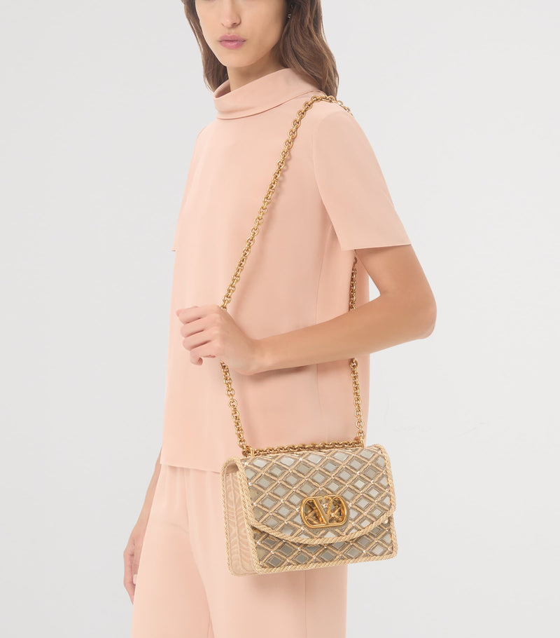 Valentino Garavani Vain shoulder bag with rhinestone embellishments (British brand)