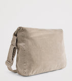 Our Legacy denim sling shoulder bag with mineral pigment, imported from the UK