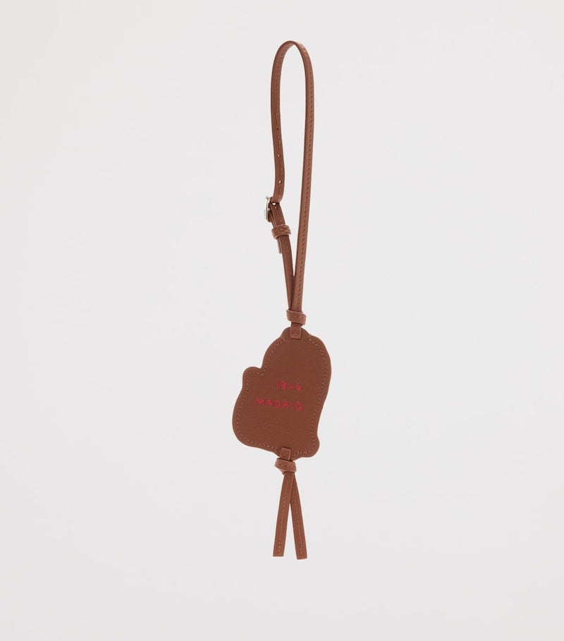 LOEWE leather tag bag charm with lion motif, UK version