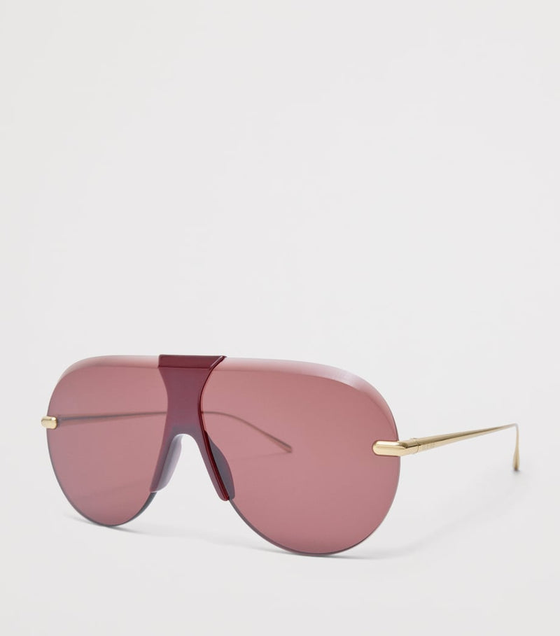 LOEWE aviator sunglasses with red tint and steel frame, imported from the UK