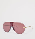 LOEWE aviator sunglasses with red tint and steel frame, imported from the UK