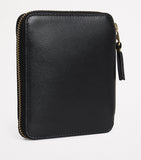 Comme des Garçons zipped leather wallet - British product