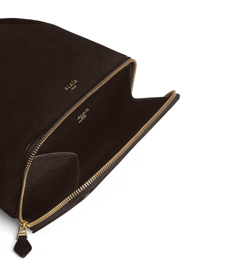Alaïa Le Ponchon suede cross-body bag, imported from the UK