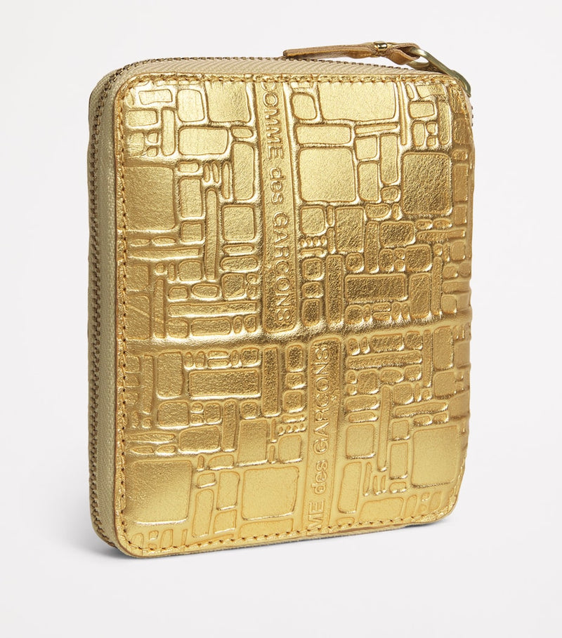 Comme Des Garçons gold embossed leather wallet, imported from the UK