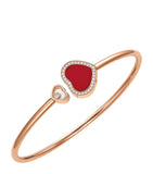 Chopard Happy Hearts rose gold bangle with moving diamond and red stone (British brand)